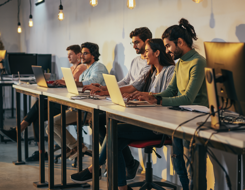 Team of professionals engaged in an office meeting, discussing business strategies and collaborating on company projects in a modern workspace